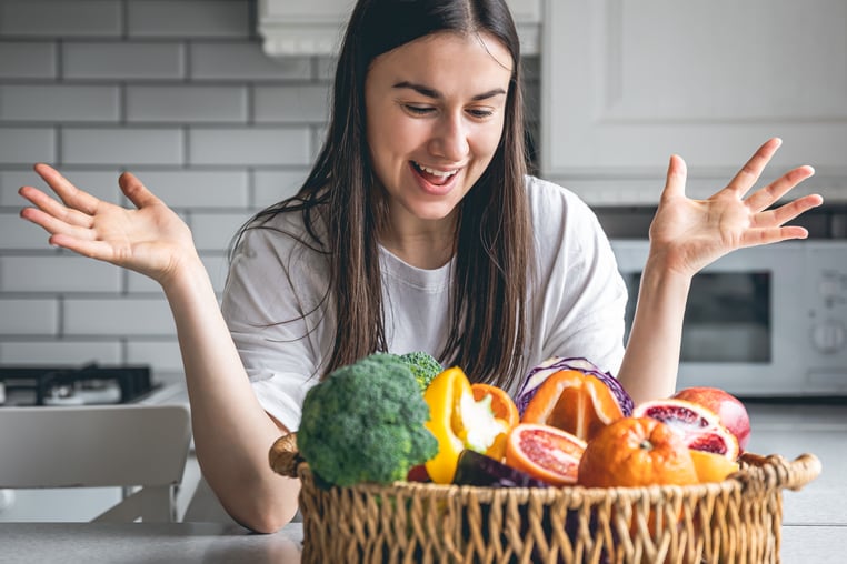 attractive-young-woman-basket-fruits-vegetables-kitchen